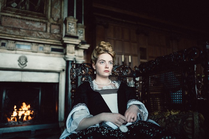 The Favourite Emma Stone sat down in 18th century dress in The Favourite