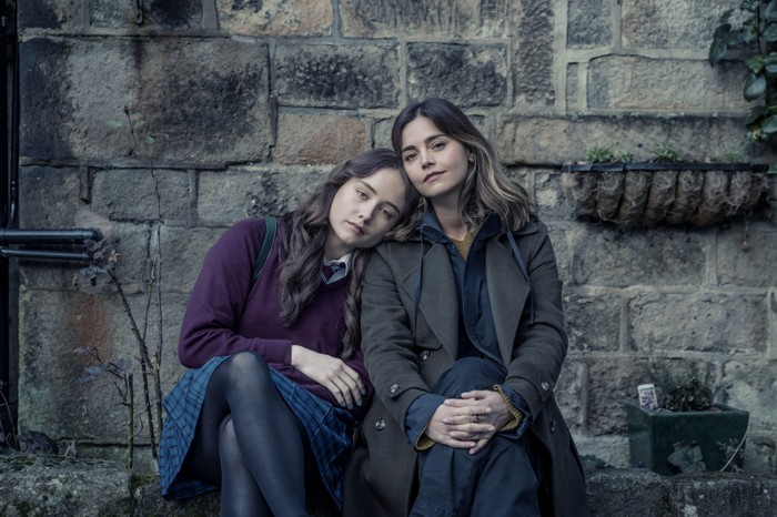 Ruby Stokes as Hannah and Jenna Coleman as Ember in The Jetty Ruby Stokes as Hannah and Jenna Coleman as Ember in The Jetty sitting together resting their heads together and looking into camera