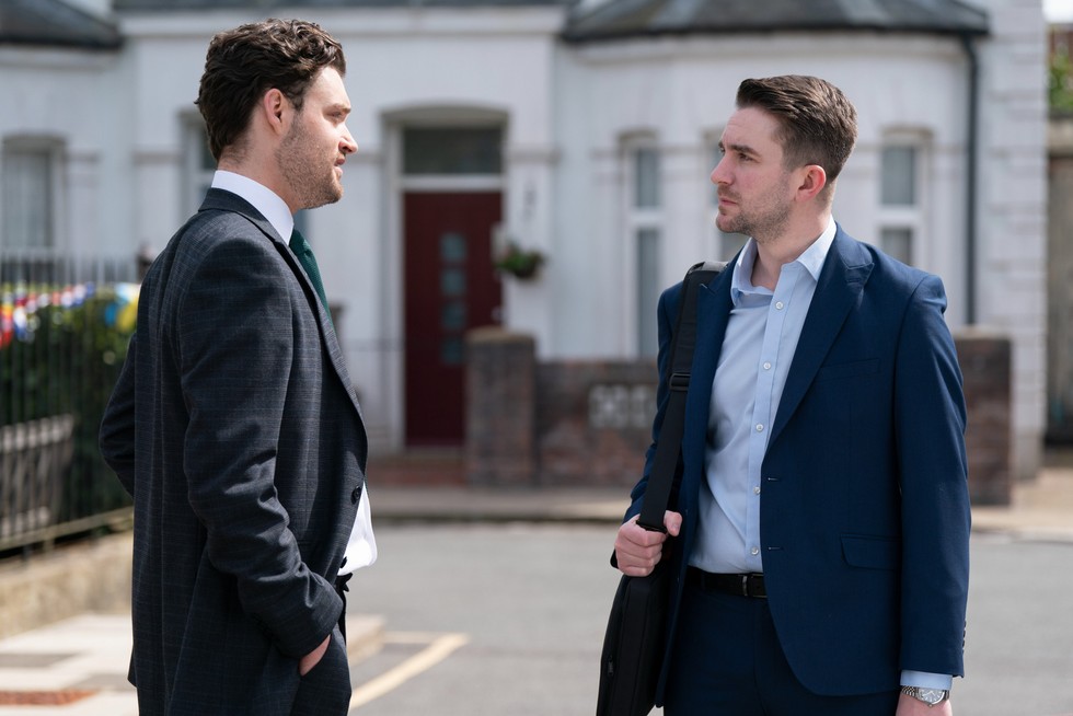 479138,EastEnders Johnny speaks to a stressed Callum, who holds a bag over his shoulder in EastEnders