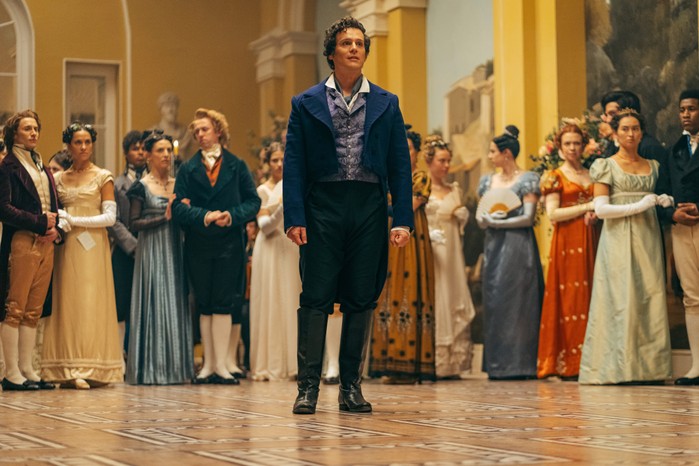 Jonathan Groff as Rogue in Doctor Who Jonathan Groff as Rogue in Doctor Who in formal attire stood in a busy ballroom