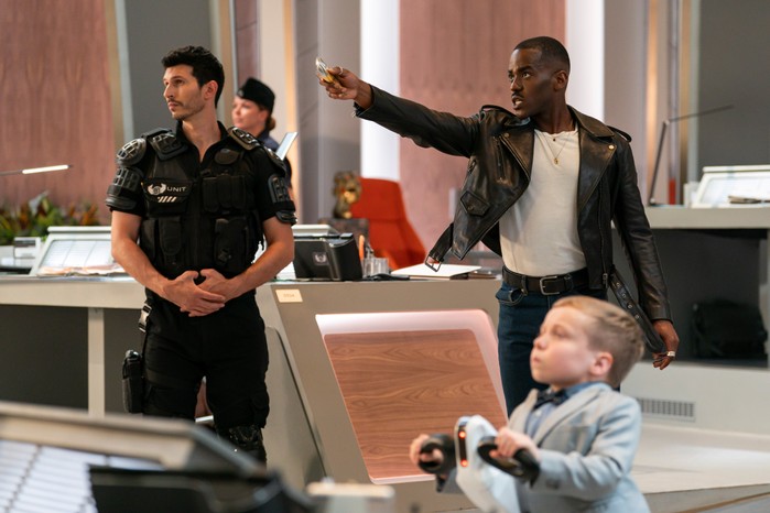 480140,Doctor Who S1 Alexander Devrient as Colonel Ibrahim, Ncuti Gatwa as The Doctor and Lenny Rush as Morris Gibbons in Doctor Who: The Legend of Ruby Sunday. The Doctor is pointing his sonic screwdriver