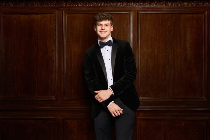 New Made In Chelsea cast member Jack Taylor New Made In Chelsea cast member Jack Taylor. He is wearing a black tuxedo and is smiling ahead. His hands are crossed in front of him.