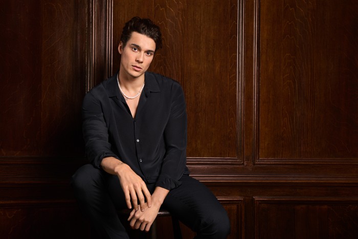 Miles Nazaire for Made in Chelsea Miles Nazaire pictured for Made in Chelsea. He is wearing a black shirt and black trousers.