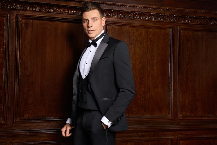 Tristan Phipps for Made in Chelsea Tristan Phipps pictured for Made in Chelsea. He is wearing a full tuxedo and has his hand in his pocket and is looking ahead.