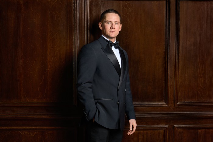 David 'Temps' Templer for Made in Chelsea David 'Temps' Templer in a full tuxedo with his hand in his pocket. He is looking ahead.