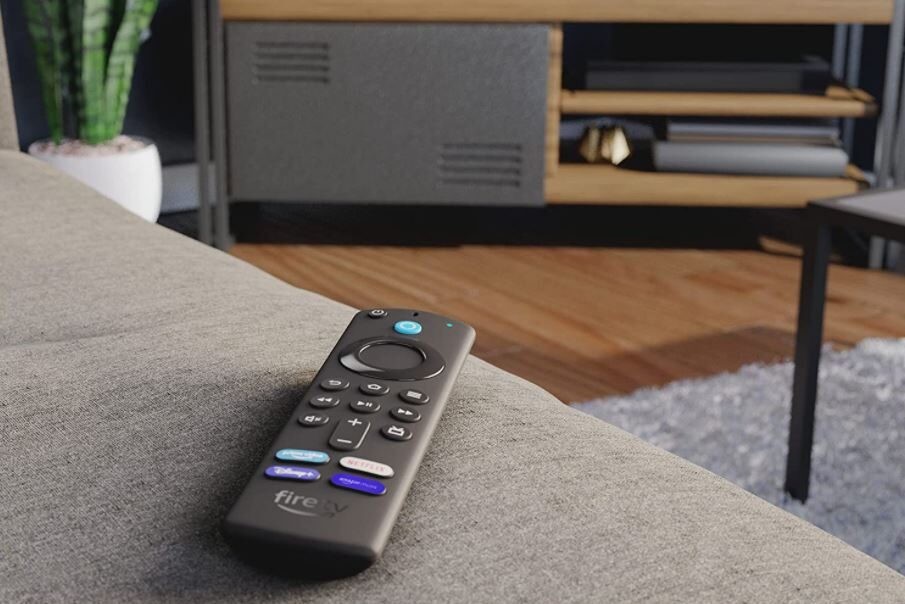 Amazon Fire TV Stick 4K Max A Fire Stick on a sofa