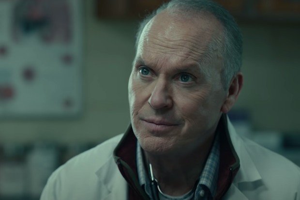 dopesick_michael_keaton Michael Keaton stars in Dopesick wearing a white lab coat looking concerned