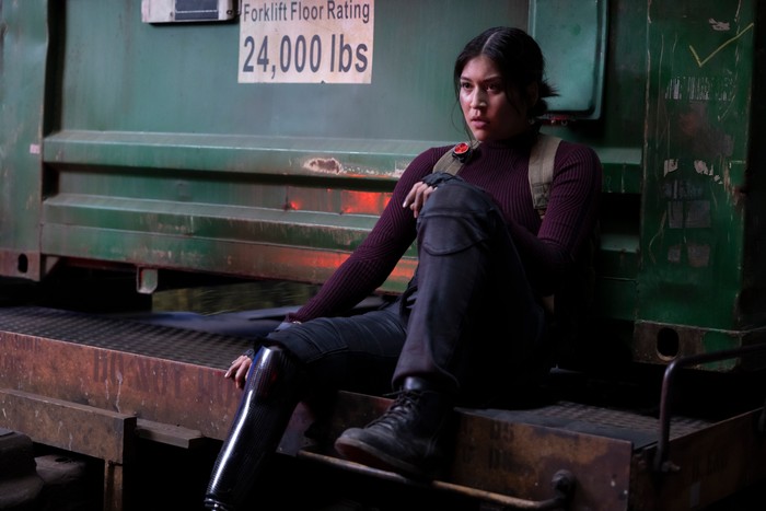 Alaqua Cox as Maya Lopez in Echo Alaqua Cox as Maya Lopez in Echo sitting down on a doorstep