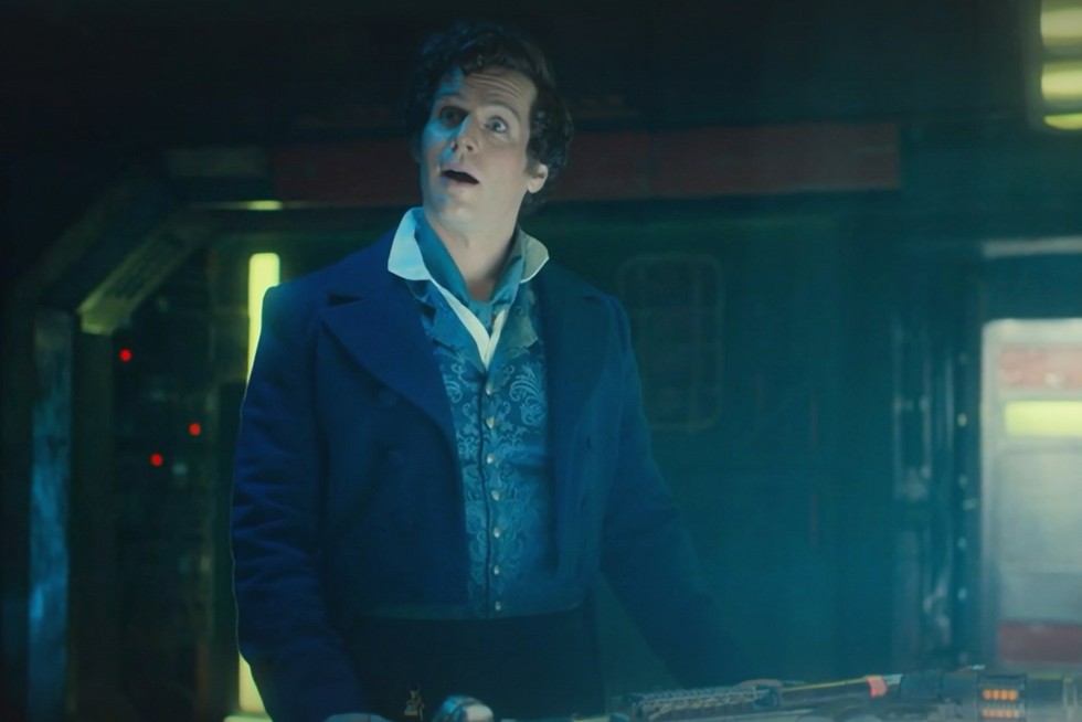 Jonathan Groff as Rogue Jonathan Groff as Rogue in Regency attire standing by the TARDIS control panel