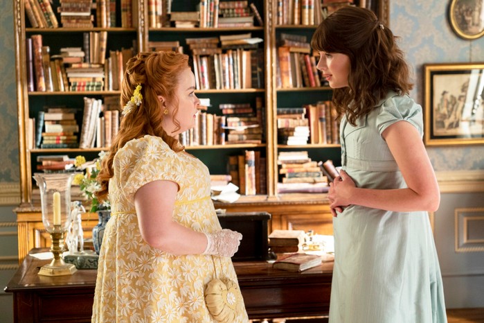 Bridgerton Eloise and Penelope standing facing one another, having a conversation