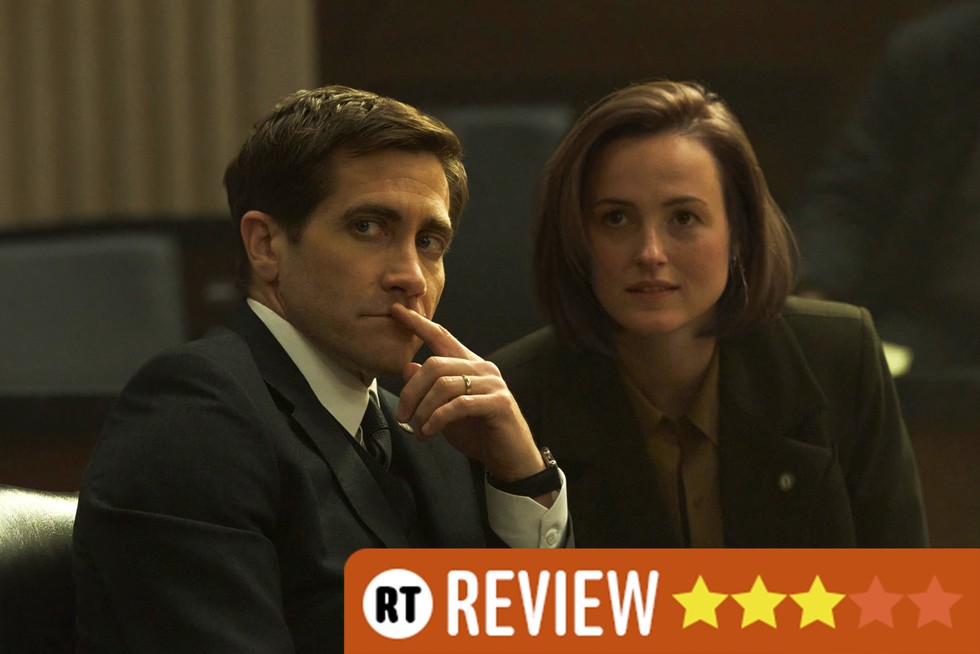 Jake Gyllenhaal Renate Reinsve Presumed Innocent Jake Gyllenhaal and Renate Reinsve in Presumed Innocent, sat next to each other, looking at something off screen. There is an RT Review banner in the bottom right corner with three stars.
