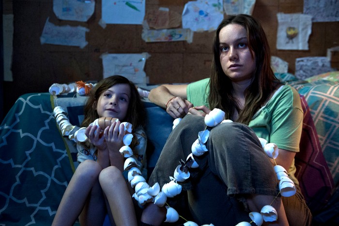 Room Brie Larson as Ma and Jacob Tremblay as Jack in Room, sat together on the floor