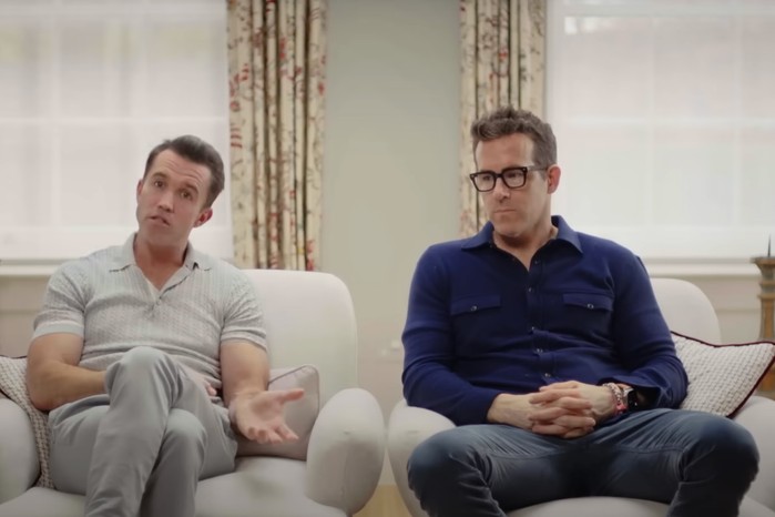 Welcome to Wrexham season 3 Ryan Reynolds and Rob McElhenney in Welcome to Wrexham season 3, sat in a room and talking to the camera