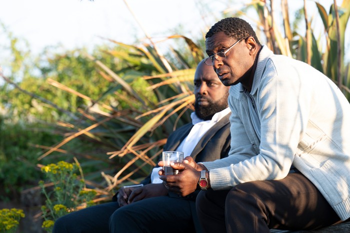 480713,Sherwood - Series 2 Michael Balogun as Harry Summers and David Harewood as Denis Bottomley, sat amongst reeds and grass