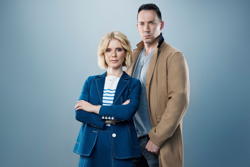 silent-witness Dr Nikki Alexander (EMILIA FOX), Jack Hodgson (DAVID CAVES) standing next to each other in front of a grey background