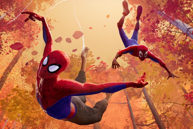 SpiderVerse_cbf_mkt_ehv476_publicity_still_final_wdalit Two spider-men swinging in Spider-Man: Into the Spider-Verse