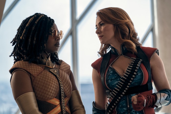 The Boys Season 4 Susan Heyward as Sister Sage and Valorie Curry as Firecracker in The Boys, in their supersuits talking to each other