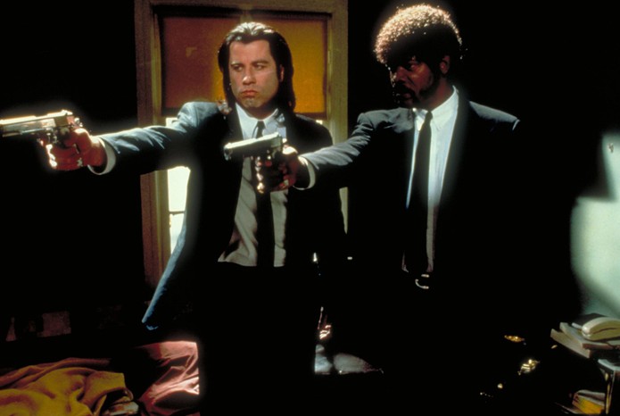 Travolta & Jackson 3 Pulp Fiction still showing John Travolta and Samuel L Jackson in suits holding pistols