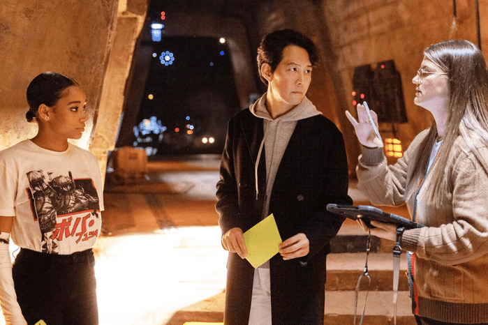 The Acolyte Amandla Stenberg, Lee Jung-jae and Leslye Headland talking on set